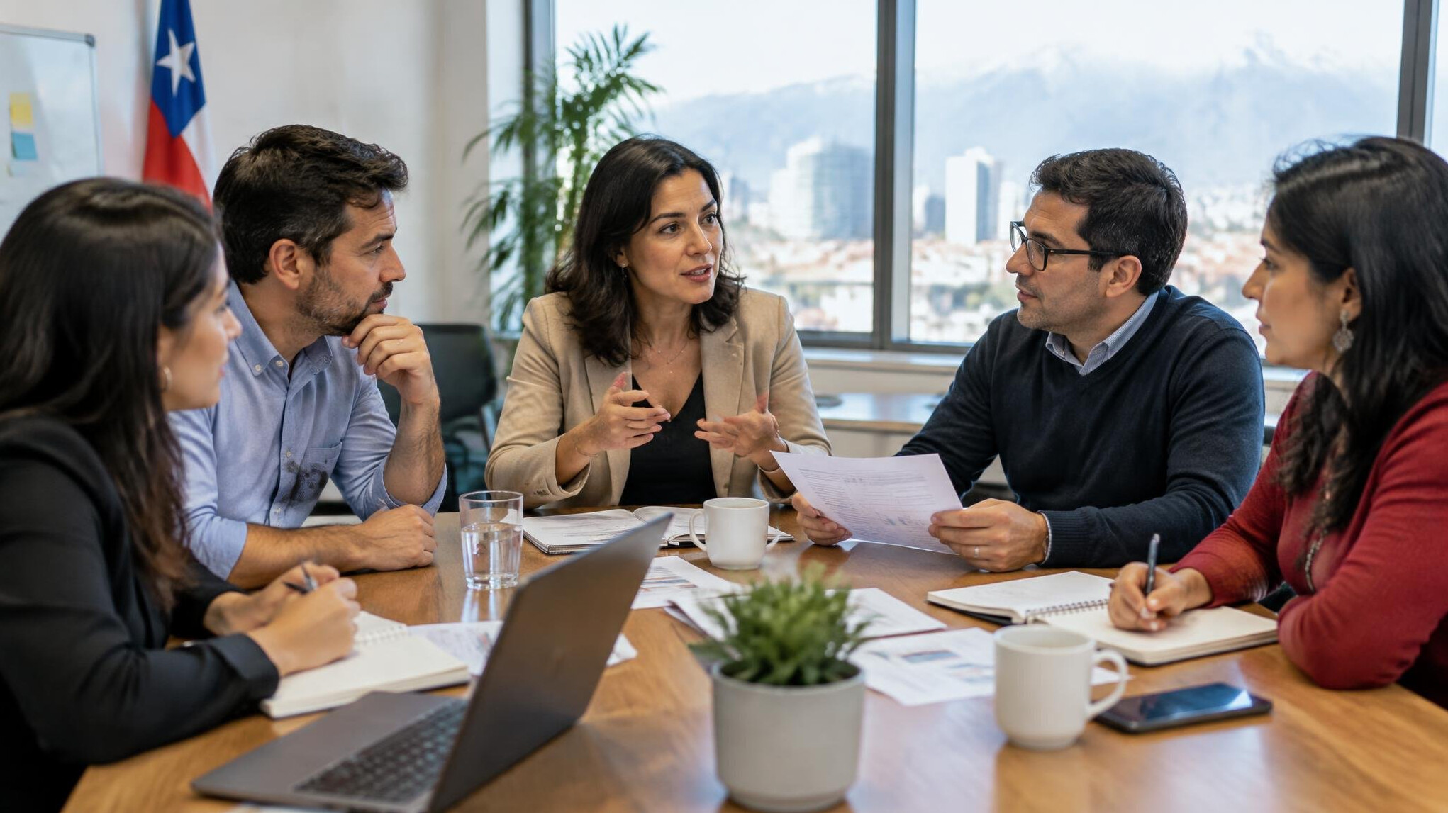 Diverse Latin American business team discussing around a table
